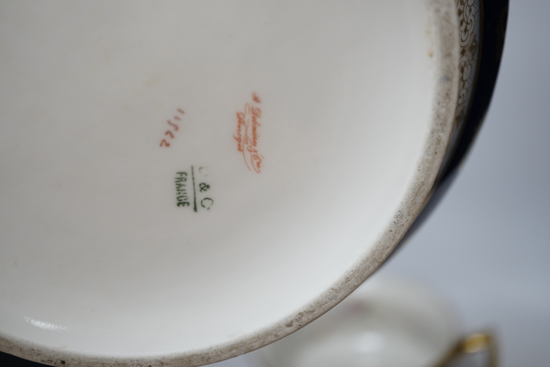 D. & C. Limoges, France, a pair of late 19th / early 20th century chamber pots, 21cm diameter. Condition - fair, some wear